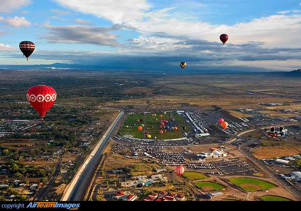What a view! This air-to-ground overview depicts the launch sites of the International Balloon Fiesta. This was the last day/event of the fiesta called 'Mass Ascension.' Various Balloons