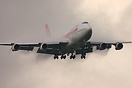 Is emerging majestically from the two to three hundred foot overcast t...