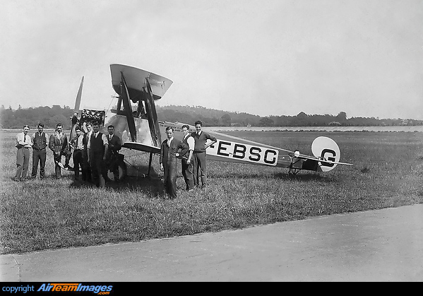 Duncan Davies who ran the Henderson Flying School(pictured in the group) took over the Brooklands School of Flying in 1928. Pictured in the background is the famous motor racing circuit with the banking of the race track. Avro 548