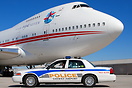 Airport Police cruiser watches over this corporate 747SP at Smyrna.
