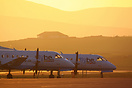 Two Loganair Saab 340s rest in the evening sunshine after completing t...