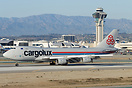 A Cargolux freighter just landed at LAX. The typical LAX terminal buil...